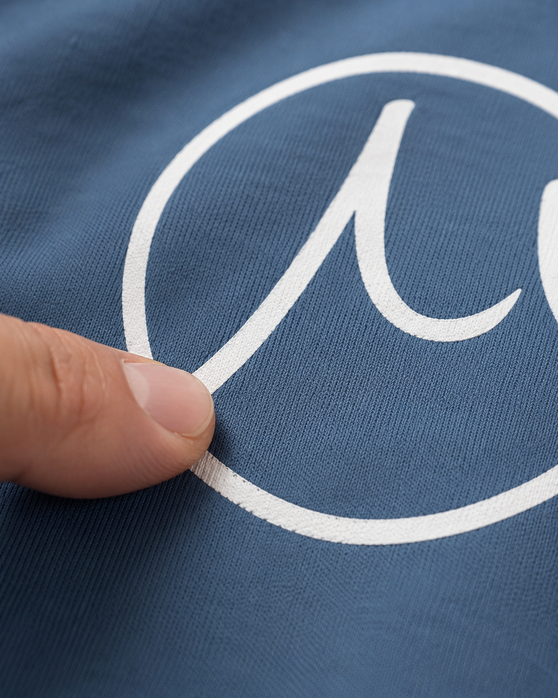 Macro detail of screen print texture in the fabric weave on Gilson tee
