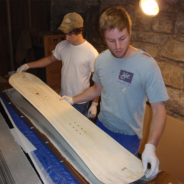 young nick and austin laying up the first snowboard