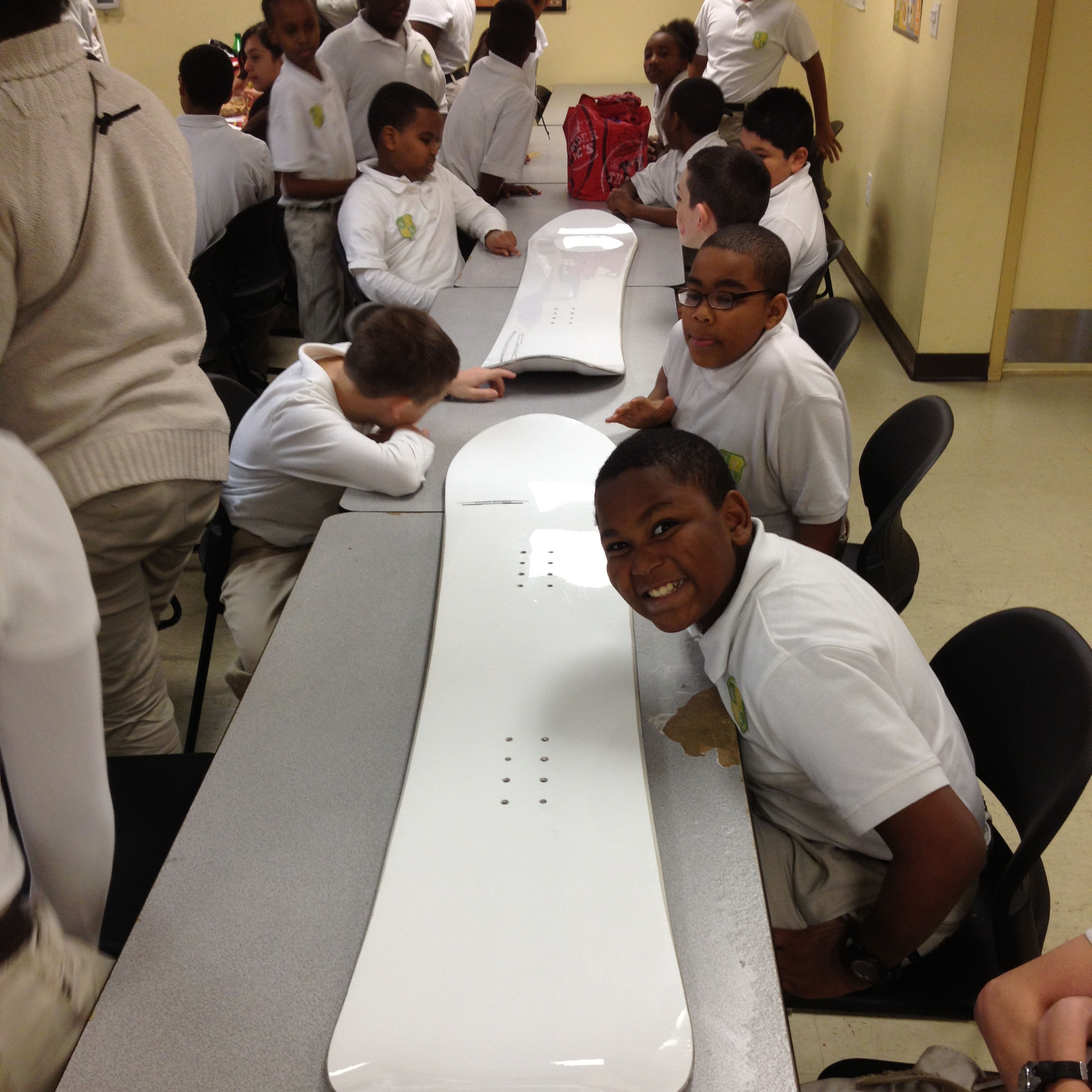 students viewing the first snowboard