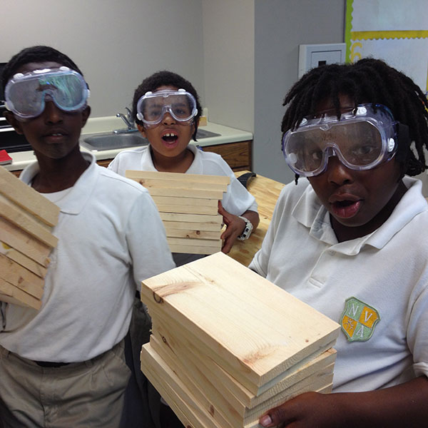 students in the class room wearing safety goggles