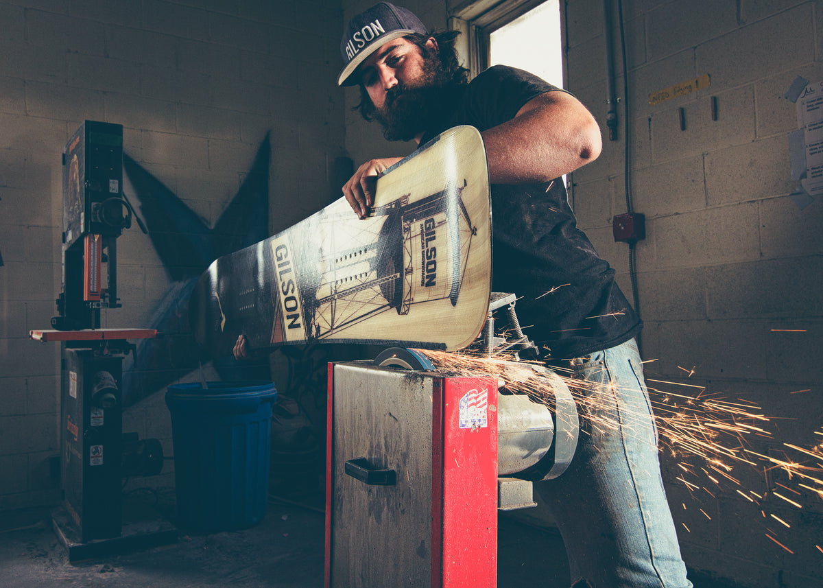 Finishing a board edge in the Gilson factory